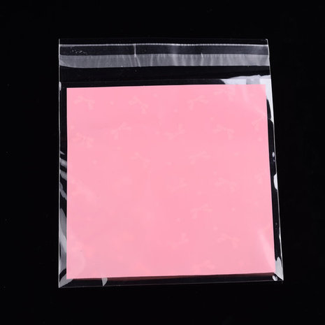 Cellofaan zakje roze met witte strikjes 10 stuks
